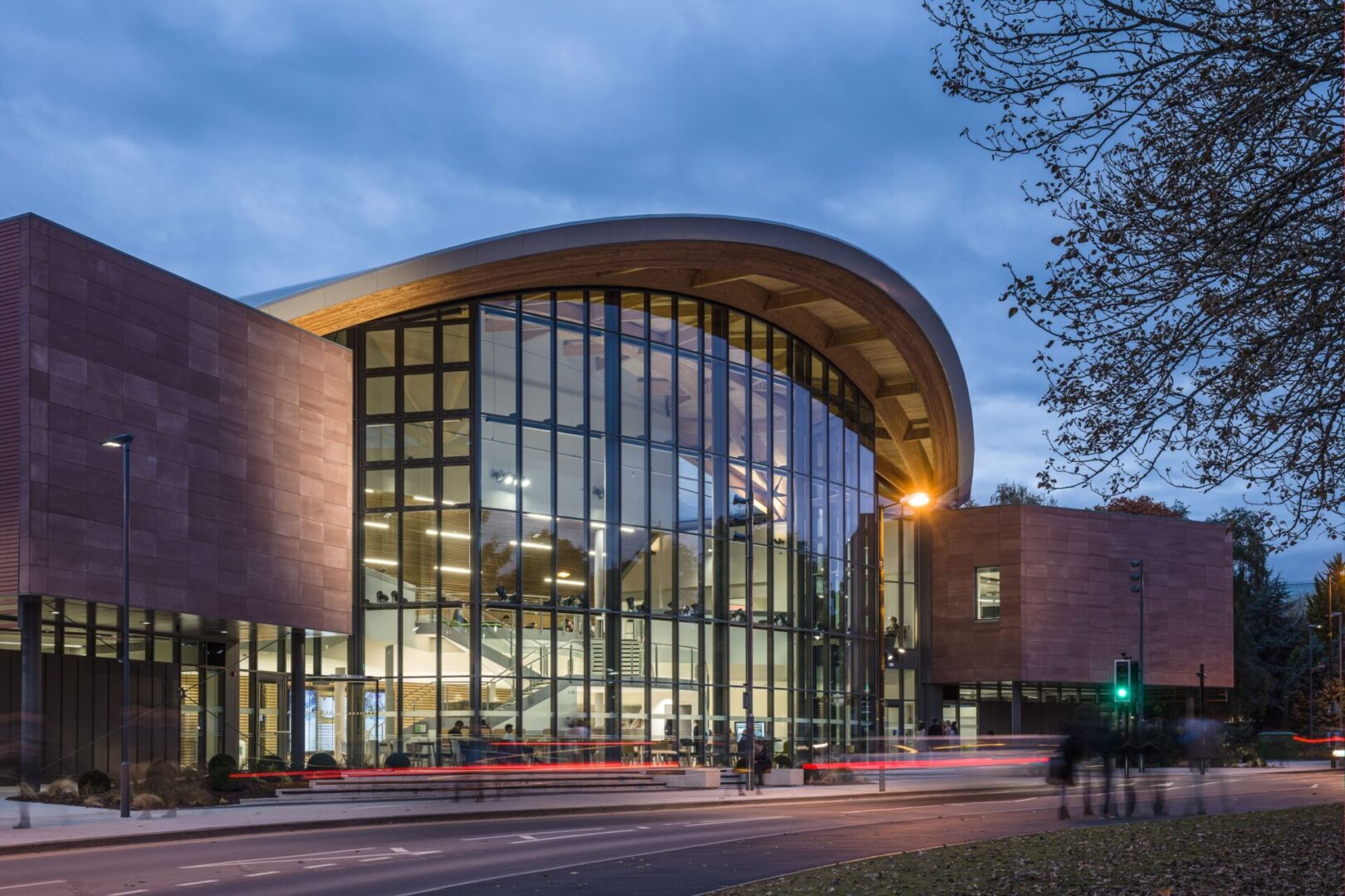 A building with many windows and glass on the outside.