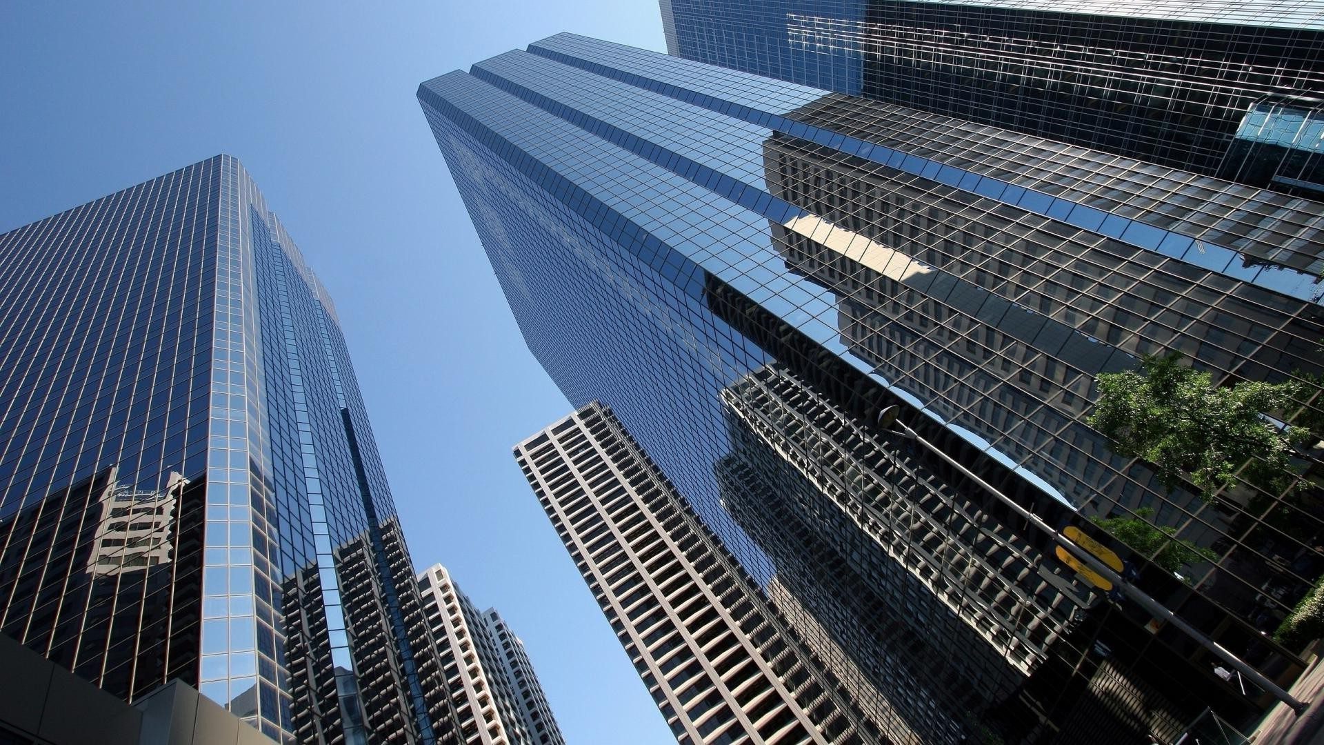 A view of some skyscrapers from below.