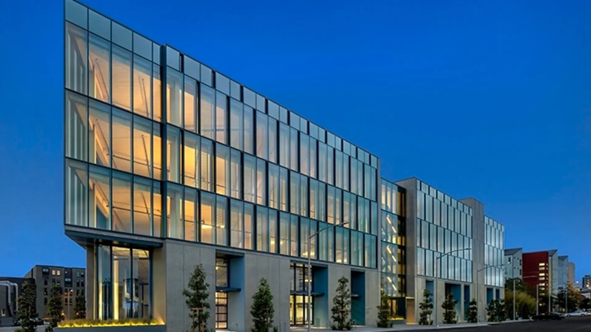 A building with many windows and lights on it