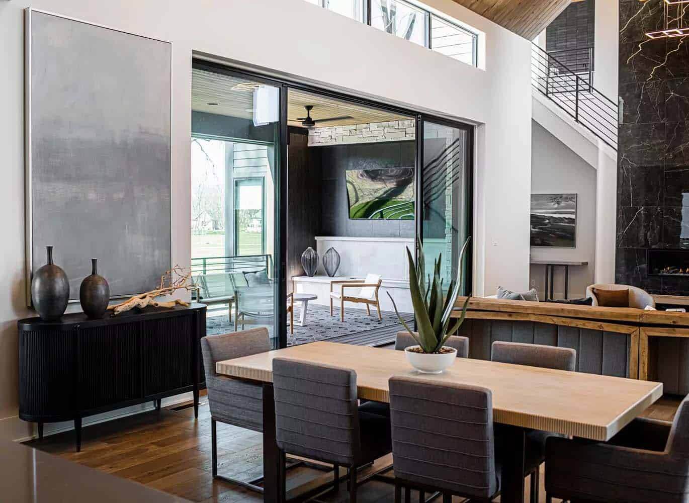 A dining room with a table and chairs in it