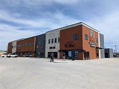 A large building with many windows and doors.