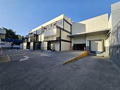 A large building with lots of windows and doors.