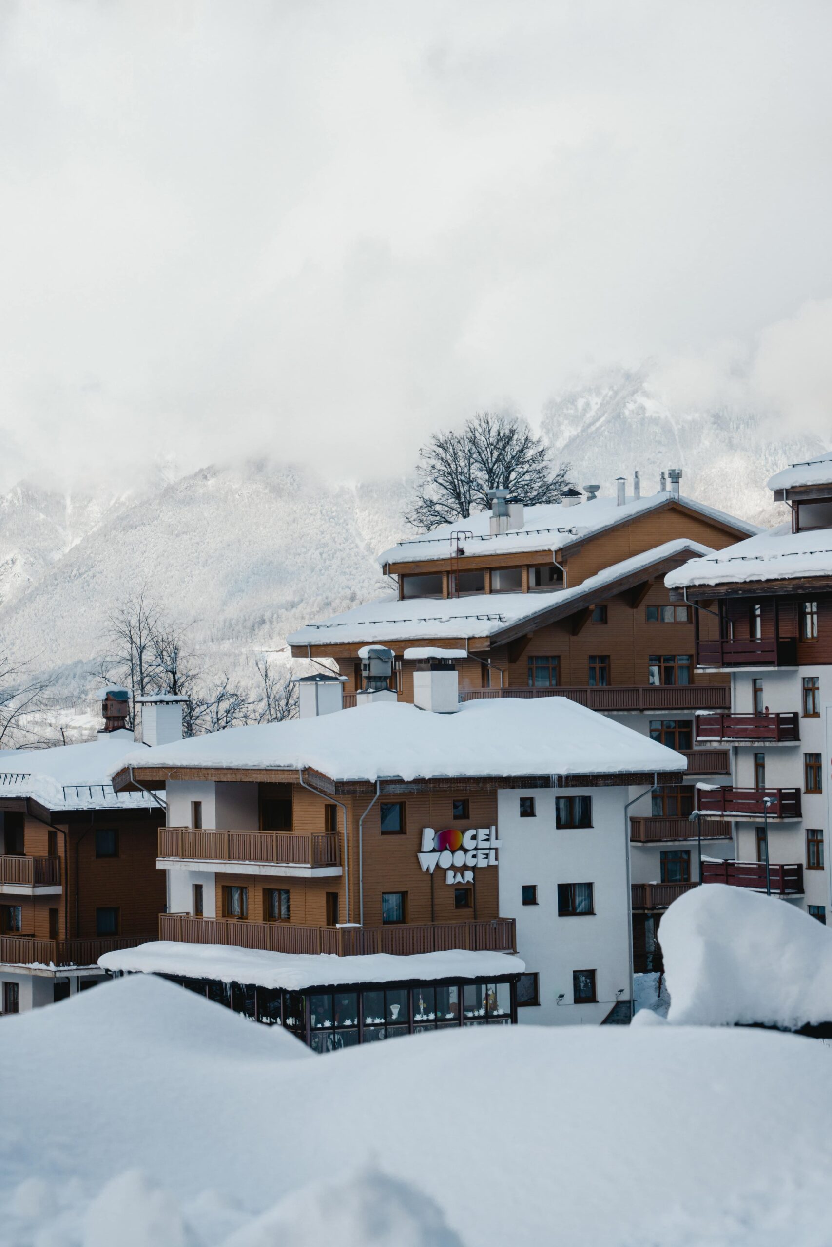 A group of buildings that are covered in snow.