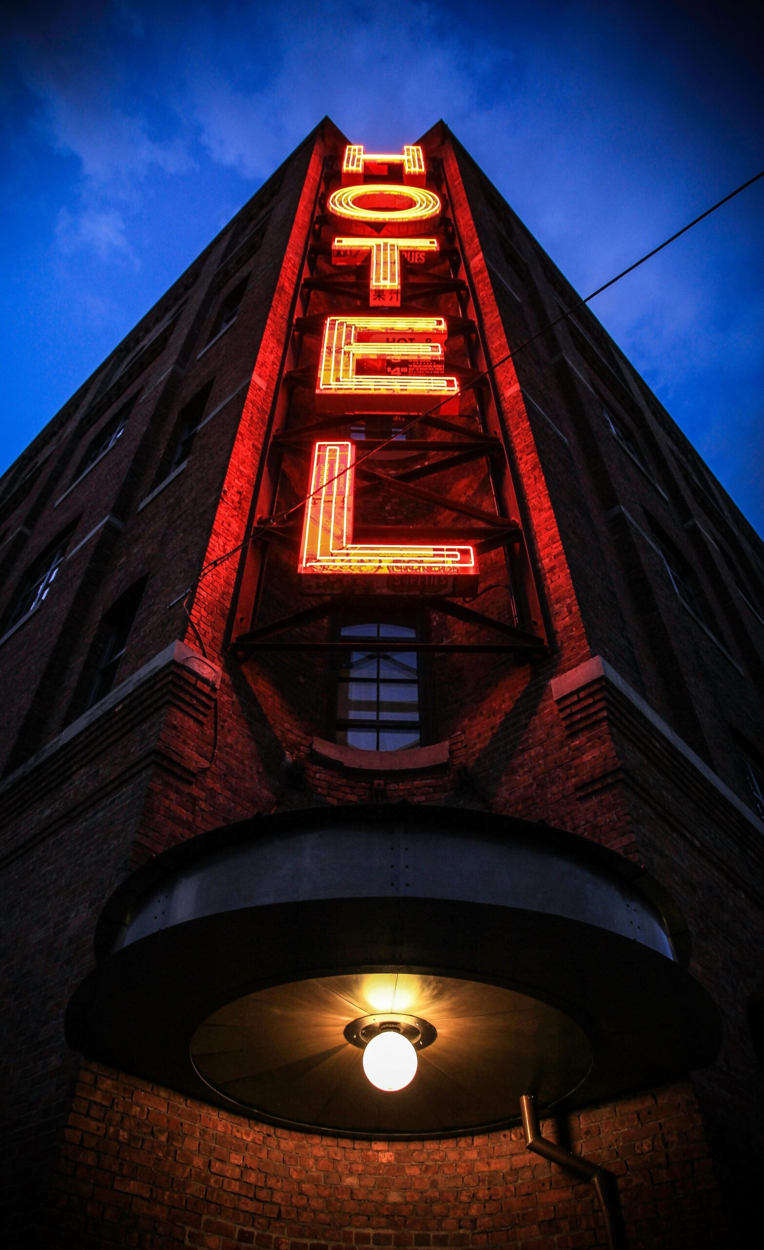 A tall building with the word " hotel " written on it.