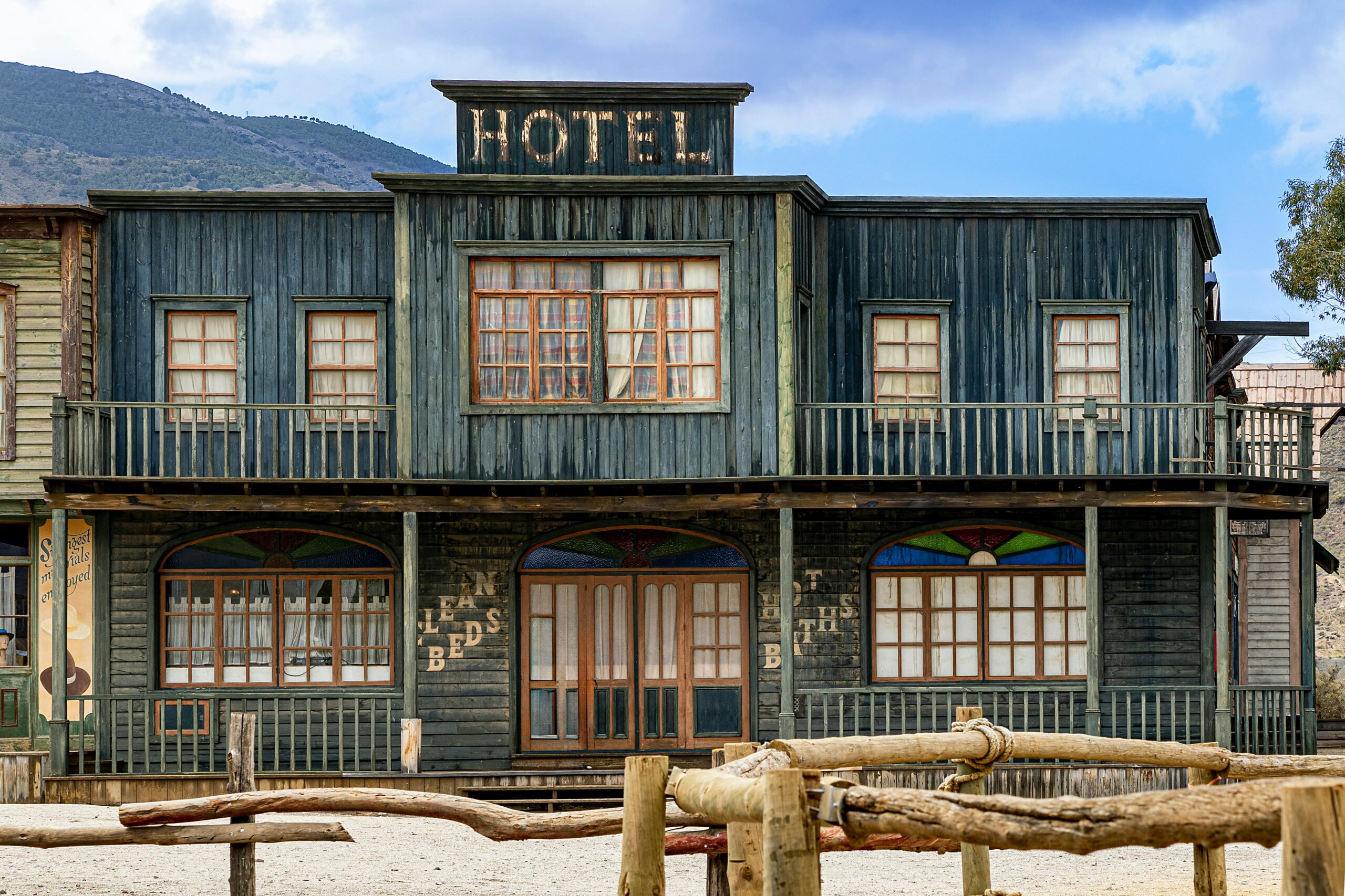 A hotel with wooden walls and windows on the outside.