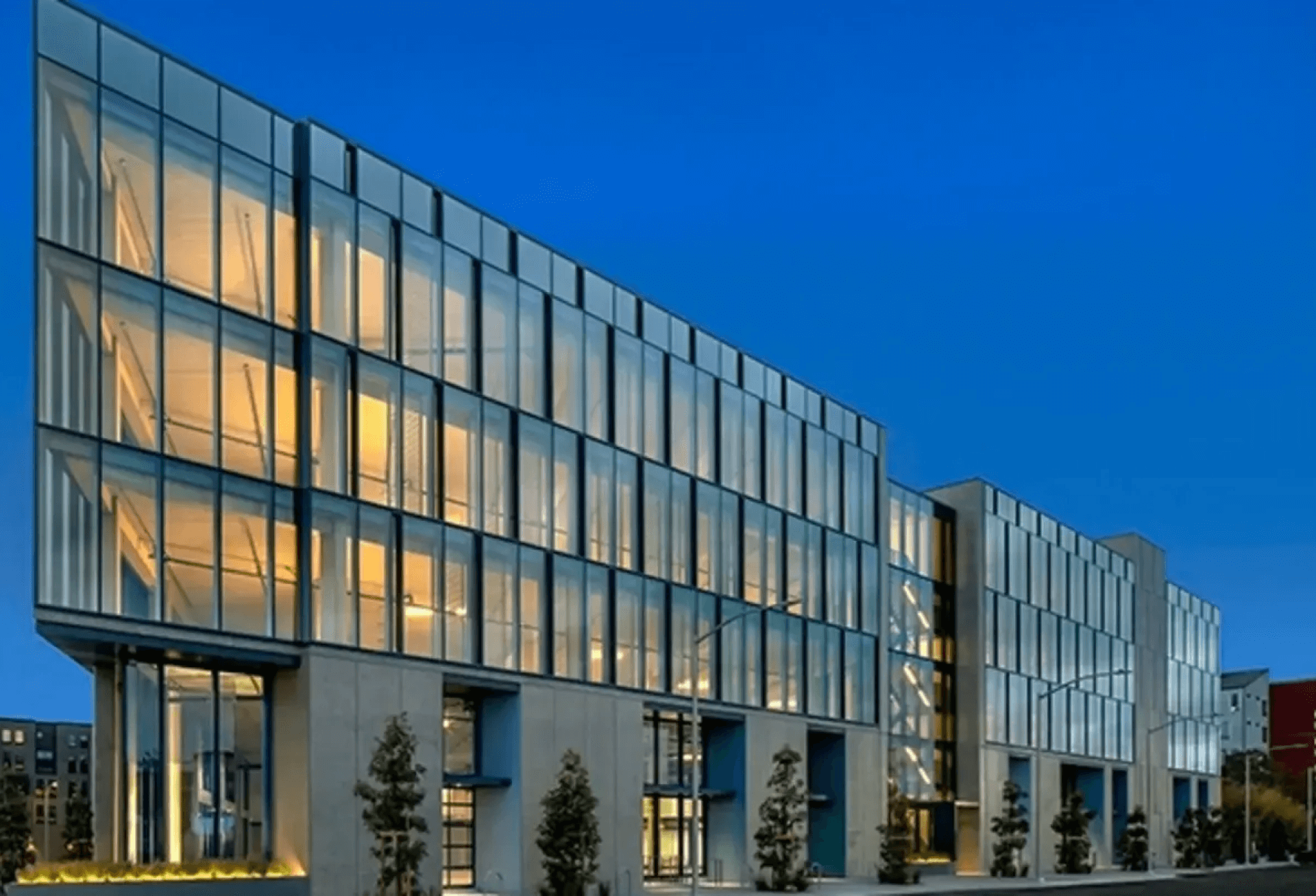 A building with many windows and lights on it